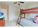 Bedroom featuring bunkbeds, carpet flooring, and a television at 10 Orchard Ave., Murrells Inlet, SC 29576