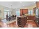 Bright kitchen with hardwood floors connecting to the dining room, featuring granite countertops and ample storage at 10 Orchard Ave., Murrells Inlet, SC 29576