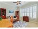 Cozy living room with natural light, comfortable seating, and red bookcases at 10 Orchard Ave., Murrells Inlet, SC 29576