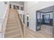 Grand foyer with a staircase, wood floors, modern railing and open floor plan at 1054 East Isle Of Palms Ave., Myrtle Beach, SC 29579