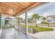 Covered front porch shows neighborhood street view with a cement floor and white railings at 1054 East Isle Of Palms Ave., Myrtle Beach, SC 29579