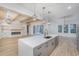 Modern kitchen featuring a large island, quartz countertops, stainless steel appliances and seamless flow to the living area at 1054 East Isle Of Palms Ave., Myrtle Beach, SC 29579