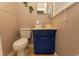 Small painted bathroom with white toilet and sink at 1105 Palmetto St., Georgetown, SC 29440