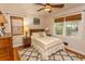 Bedroom with dresser, ceiling fan, hardwood floors, and natural lighting at 1105 Palmetto St., Georgetown, SC 29440