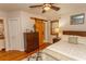 Bedroom with dresser, ceiling fan, hardwood floors, and accent lighting at 1105 Palmetto St., Georgetown, SC 29440