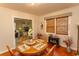 Cozy dining room with a round wooden table and vintage decor at 1105 Palmetto St., Georgetown, SC 29440