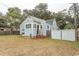 Exterior of a blue cottage-style home with a fenced-in backyard at 1105 Palmetto St., Georgetown, SC 29440