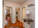 Hallway with hardwood flooring, multiple bedrooms, and hallway table at 1105 Palmetto St., Georgetown, SC 29440