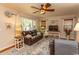 Relaxing living room with a large sofa, big window, and ceiling fan at 1105 Palmetto St., Georgetown, SC 29440