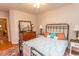 Comfortable bedroom featuring an iron bed frame, hardwood floors and a decorative rug at 1105 Palmetto St., Georgetown, SC 29440