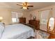 Comfortable bedroom with a ceiling fan, hardwood floors and natural light at 1105 Palmetto St., Georgetown, SC 29440