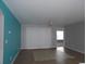 Bright living room with tile floors and a ceiling fan at 113 Butkus Dr. # 3, Myrtle Beach, SC 29588