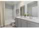 Well-lit bathroom features a double sink vanity, a shower-tub combo and neutral tones, creating a clean, functional space at 124 Shucking St., Myrtle Beach, SC 29588