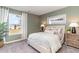 Cozy bedroom featuring a comfortable bed, soft lighting, and an outdoor view at 124 Shucking St., Myrtle Beach, SC 29588