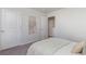 Bright bedroom featuring neutral walls, carpet, and an open closet, offering a simple and versatile space at 124 Shucking St., Myrtle Beach, SC 29588