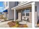 Inviting front porch with brick accents and a cozy bench, creating a welcoming entrance at 124 Shucking St., Myrtle Beach, SC 29588