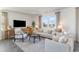 Comfortable living room featuring modern furniture, a large window, and a wall-mounted TV at 124 Shucking St., Myrtle Beach, SC 29588