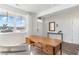 Sunlit office featuring a spacious wooden desk, white walls, and serene backyard views at 124 Shucking St., Myrtle Beach, SC 29588