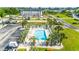 Aerial view of community pool surrounded by palm trees and community buildings, boat storage, and parking at 131 Waypoint Ridge Ave. # Q-14, Little River, SC 29566