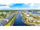 A panoramic aerial perspective featuring waterfront houses, boat docks, and lush vegetation along the picturesque waterway at 131 Waypoint Ridge Ave. # Q-14, Little River, SC 29566