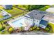 Aerial view of community pool and spa surrounded by lush landscaping at 131 Waypoint Ridge Ave. # Q-14, Little River, SC 29566