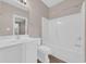 Bright bathroom with a shower-tub combination and white vanity at 131 Waypoint Ridge Ave. # Q-14, Little River, SC 29566