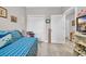 Bedroom featuring a daybed with blue coverings, closet, and light-toned hardwood flooring at 131 Waypoint Ridge Ave. # Q-14, Little River, SC 29566