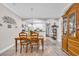 Bright dining area open to kitchen featuring wood table with seating for four at 131 Waypoint Ridge Ave. # Q-14, Little River, SC 29566