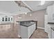 Bright kitchen area with white cabinets, modern appliances, and granite countertops overlooking the living space at 131 Waypoint Ridge Ave. # Q-14, Little River, SC 29566