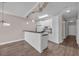 Open-concept kitchen featuring white cabinets, modern appliances, and a breakfast bar with black countertops at 131 Waypoint Ridge Ave. # Q-14, Little River, SC 29566