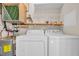 Laundry area features modern washer and dryer, plus storage shelves at 131 Waypoint Ridge Ave. # Q-14, Little River, SC 29566