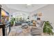 Cozy living room with fireplace, fan, and lots of natural light from bay window at 131 Waypoint Ridge Ave. # Q-14, Little River, SC 29566