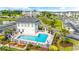 Inviting community pool and jacuzzi with picnic benches and lovely landscaping surrounded by residences and parking at 131 Waypoint Ridge Ave. # Q-14, Little River, SC 29566