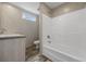 Bathroom featuring a vanity, toilet, shower and window offering natural light at 1310 Rabbit Ln., Conway, SC 29526