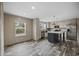 Bright kitchen with stainless steel appliances, center island, and wood-look flooring at 1310 Rabbit Ln., Conway, SC 29526