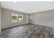 Inviting living room with wood-look floors, bright windows, and neutral wall colors at 1310 Rabbit Ln., Conway, SC 29526