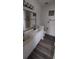 A well-lit bathroom featuring a double vanity and a bathtub at 134 Clovis Circle, Myrtle Beach, SC 29579