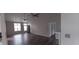 Bright living room with sleek gray flooring, multiple ceiling fans, and neutral gray paint at 134 Clovis Circle, Myrtle Beach, SC 29579