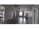 Bright living room featuring sleek gray flooring, multiple ceiling fans, and neutral gray paint at 134 Clovis Circle, Myrtle Beach, SC 29579