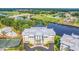 An eye-level aerial shot of a building near a golf course, lake, and pedestrian bridge at 1352 Villa Marbella Ct. # 1-304, Myrtle Beach, SC 29572