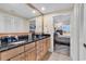 Bathroom featuring dual vanities, a granite countertop and backsplash and access to the main bedroom at 1352 Villa Marbella Ct. # 1-304, Myrtle Beach, SC 29572