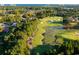 Aerial view of a lush golf course with ponds and surrounding residential area at 1352 Villa Marbella Ct. # 1-304, Myrtle Beach, SC 29572