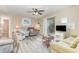 Relaxing living room with ceiling fan, light colored walls, wood-look floors, and comfortable furnishings at 1356 Glenns Bay Rd. # 203K, Myrtle Beach, SC 29575