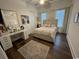 Bright bedroom with dark hardwood floors, desk, and large vanity mirror at 1391 Peterson St., Myrtle Beach, SC 29577