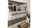 Kitchen featuring seating at bar with modern white countertop and woven stools, blending in with the living room at 1391 Peterson St., Myrtle Beach, SC 29577