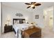 Comfortable bedroom featuring a ceiling fan, a cozy quilt, and a sitting chair near the window at 1442 Chanson Ct., Little River, SC 29566