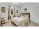 Cozy bedroom with neutral tones, decorative pillows, and natural light from the window at 1442 Chanson Ct., Little River, SC 29566