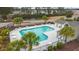 Aerial view of the community pool with tables and a restroom at 1442 Chanson Ct., Little River, SC 29566