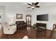 Cozy living room boasts hardwood floors and a large screen tv at 1442 Chanson Ct., Little River, SC 29566