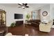 Inviting living room showcasing hardwood floors, neutral walls, and ample seating for entertaining at 1442 Chanson Ct., Little River, SC 29566